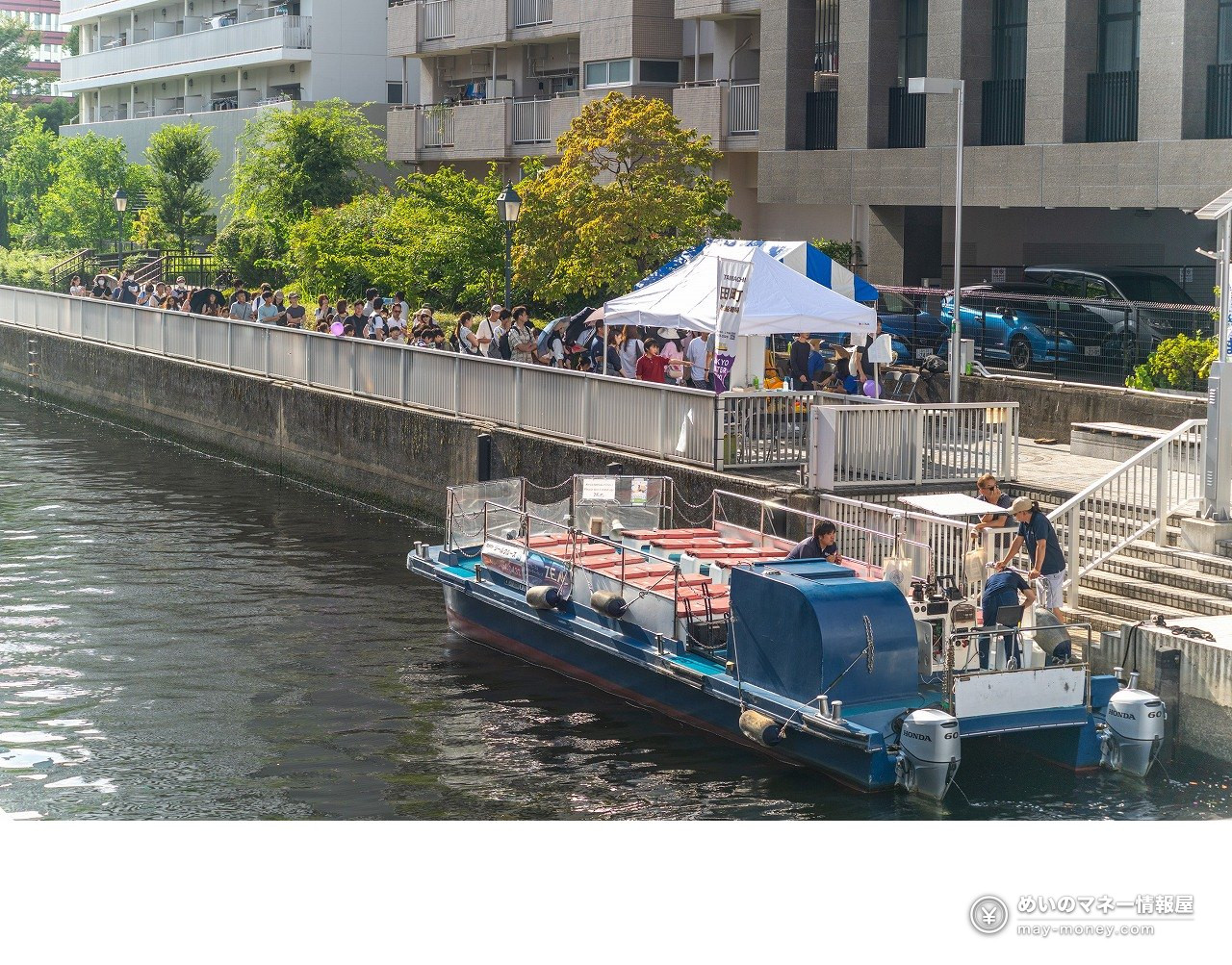 Shibaura Canal Festival 2026: Free Canal Cruise Times & Tips 3 A cruise boat moored beside the canal walkway, with festival tents above