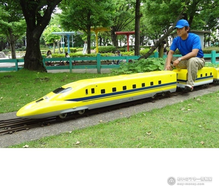Haneda Airport Vehicle Festival: Free Entry, Oct 31–Nov 1 5 A man riding a yellow mini Shinkansen train in a park