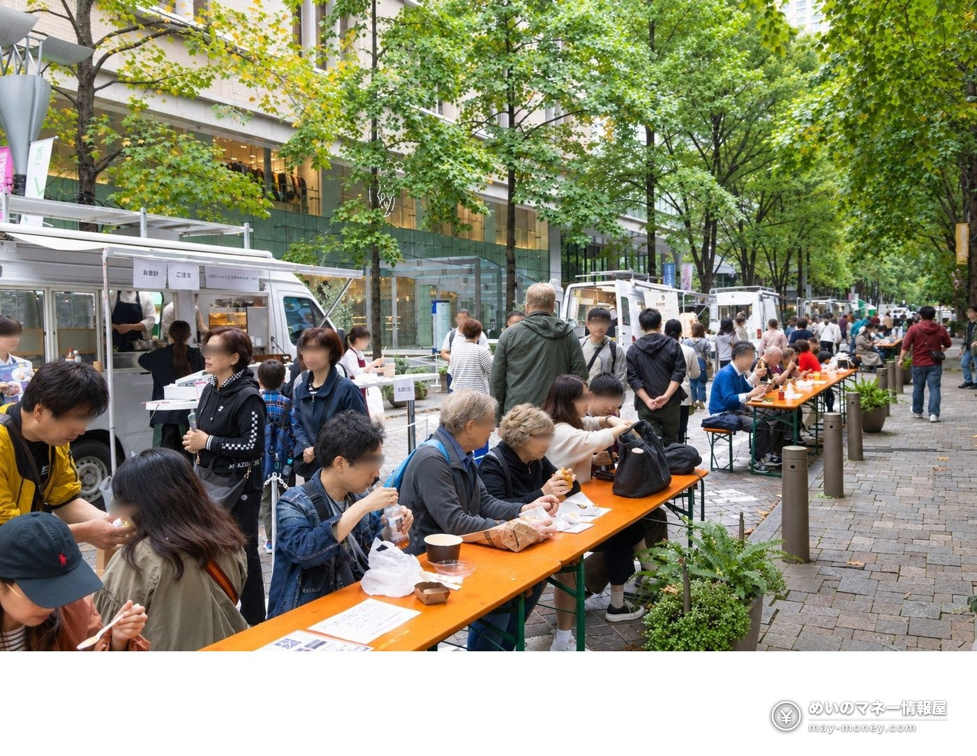 Taste of Tokyo 2026: Tokyo-Grown Food Festival in Marunouchi, Hibiya and Toyosu (Oct 23–25) 3 People eating at long tables in front of kitchen cars on a tree-lined street