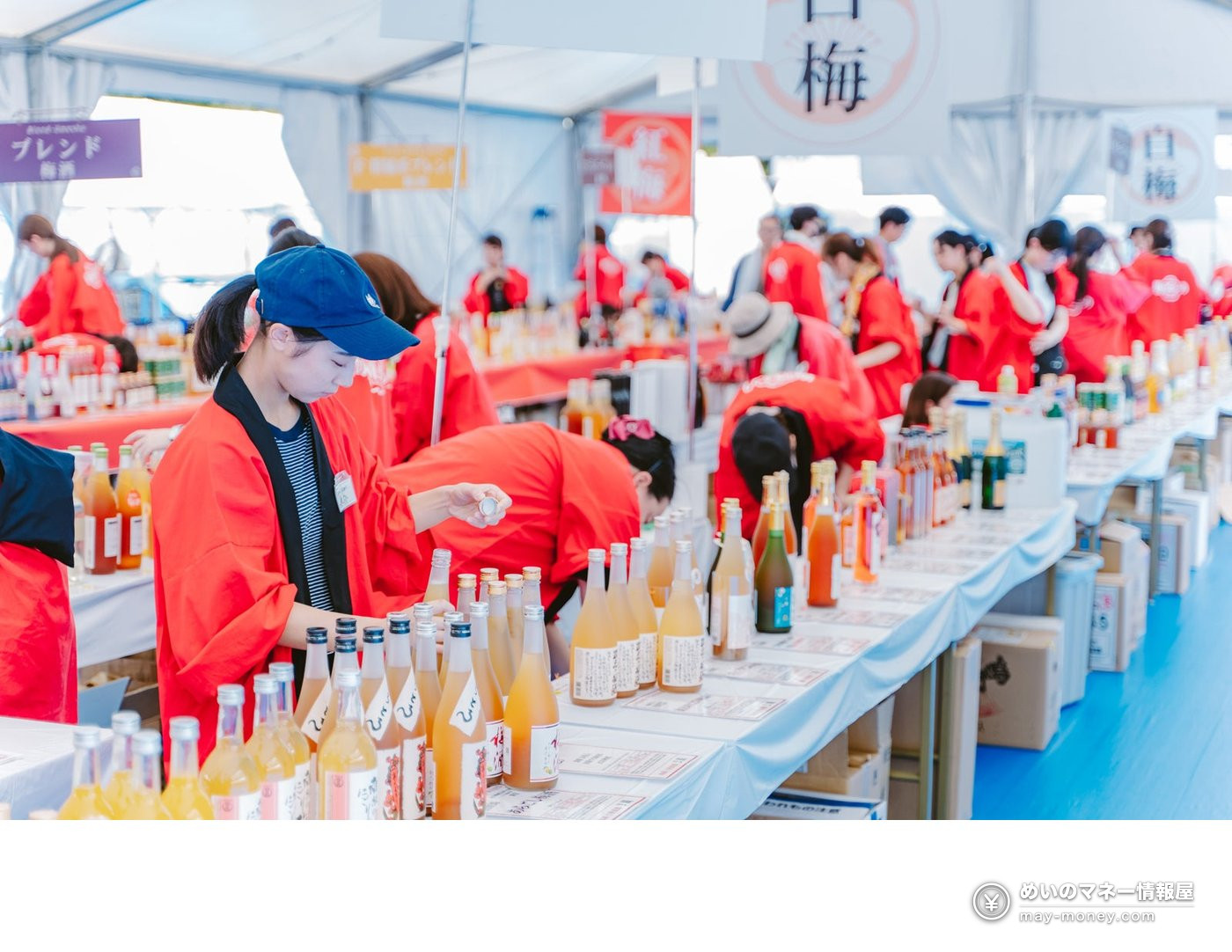 Yokosuka Umeshu Festival: Tickets, Tastings and RPG 2 Festival tasting area with rows of umeshu bottles and staff wearing red happi coats