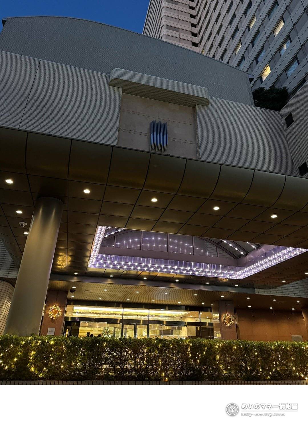 Hotel Metropolitan building and driveway seen from below, decorated with lights