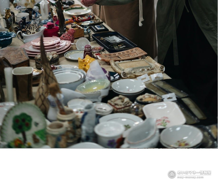 Secondhand plates, bowls and small ornaments laid out on a table