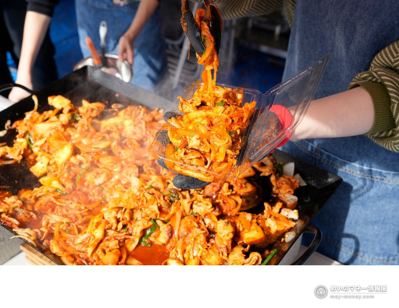 Furusato Shibuya Festival at Yoyogi Park: Free Entry, Akita Dogs, Ponies and 130 Tents (Nov 7–8) 3 Spicy red stir-fried meat and vegetables being served from a griddle at a food tent
