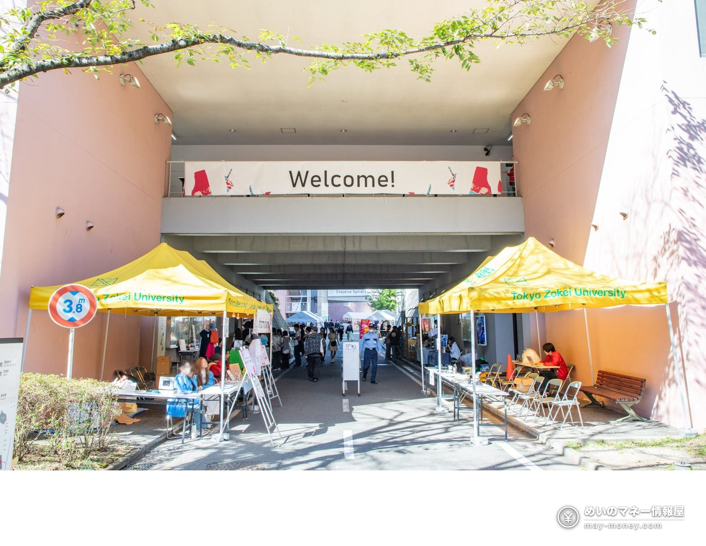 Visitors beside a yellow welcome tent at the 2025 CS Festival